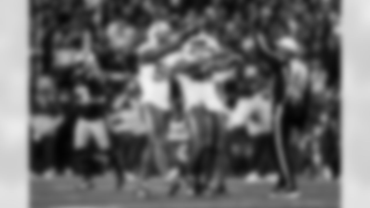 OLB Odafe Oweh (98) and OLB Tuli Tuipulotu (45)