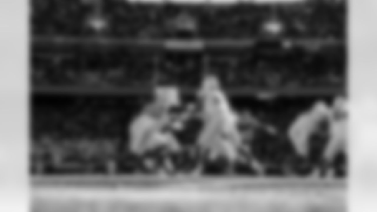 RB Kimani Vidal (30) and QB Justin Herbert (10)