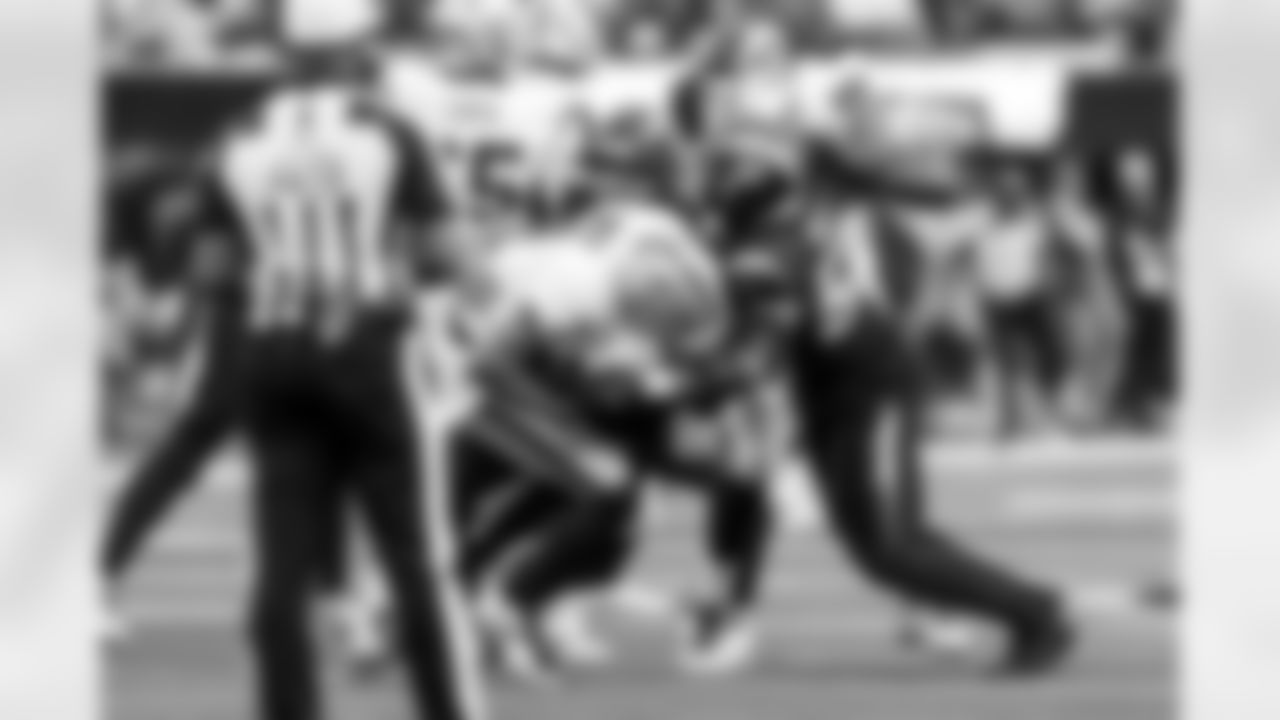 OLB Tuli Tuipulotu (45) and OLB Khalil Mack (52)