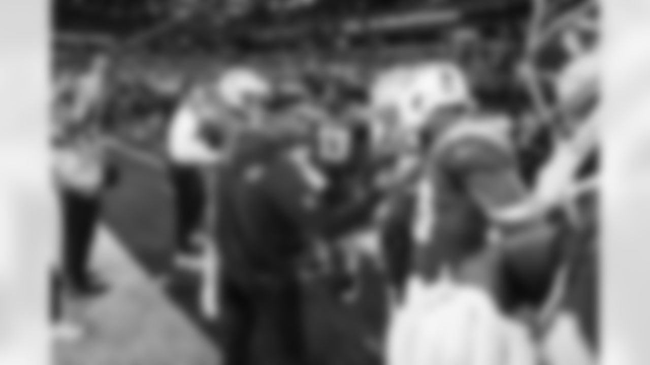 Special Teams Coordinator Ryan Ficken, DB Deane Leonard (33) and LB Marlowe Wax (58)