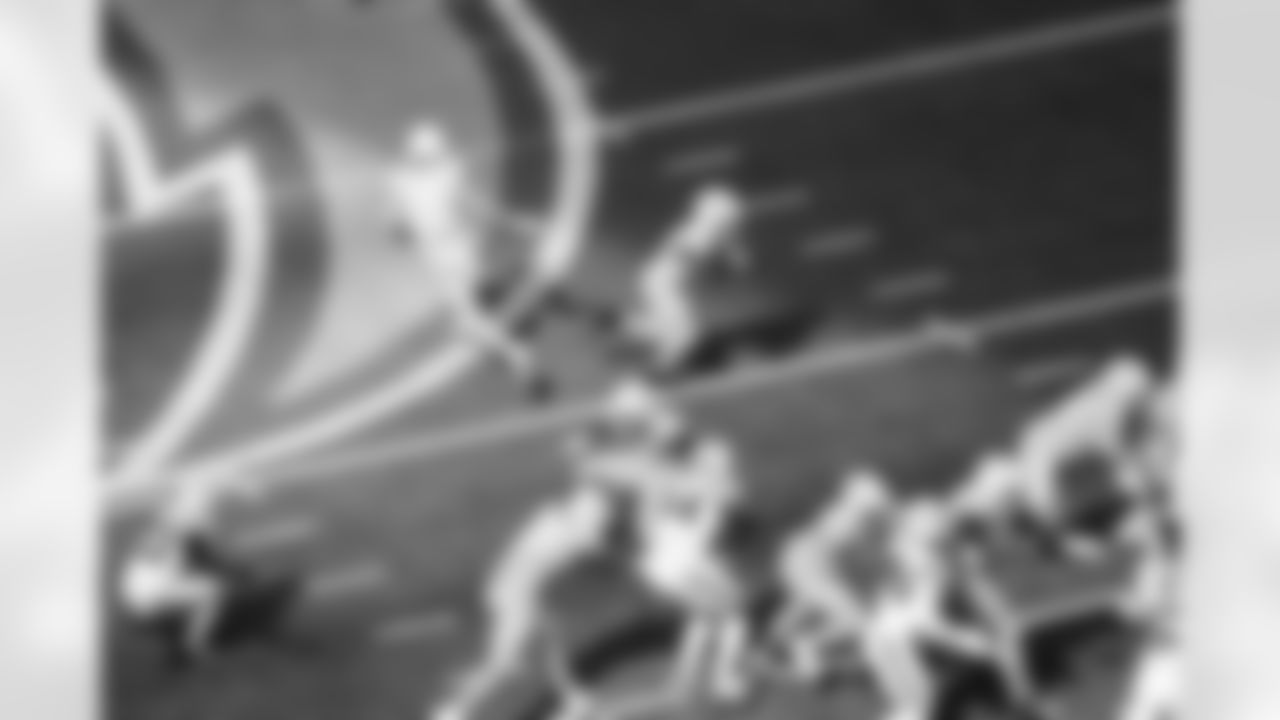 QB Justin Herbert (10) and RB Kimani Vidal (30)