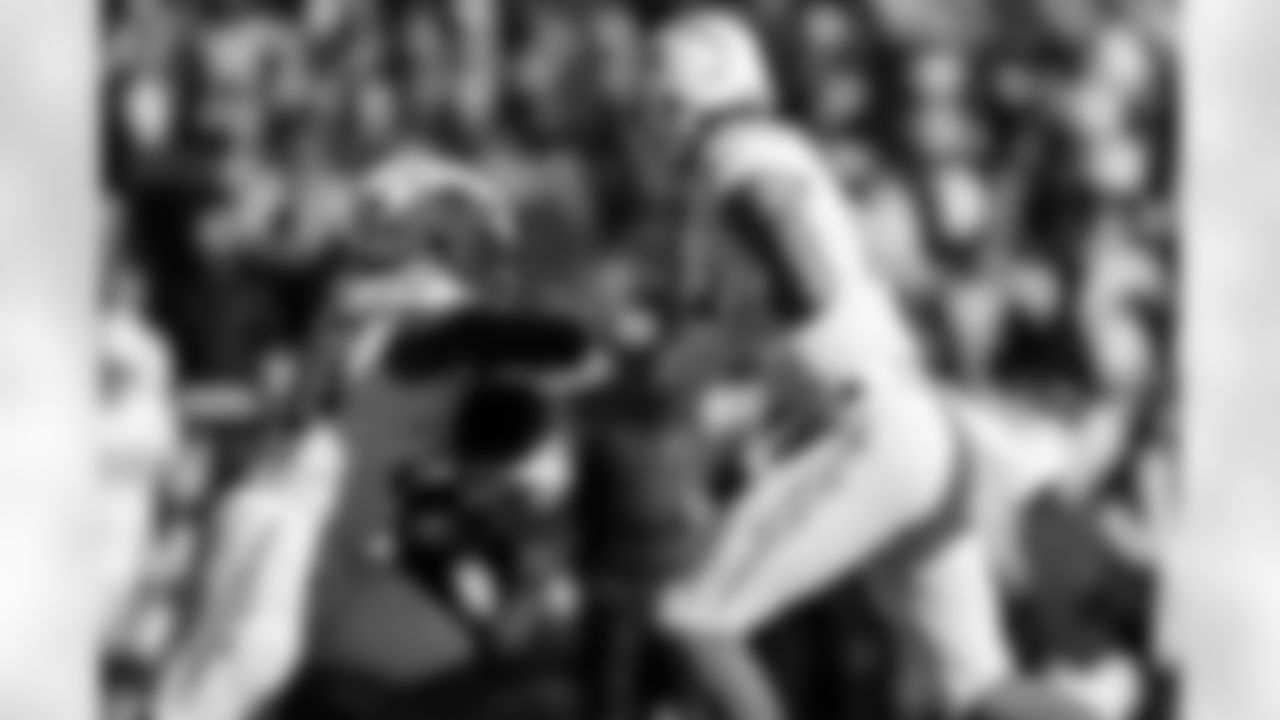 RB Kimani Vidal (30) and QB Justin Herbert (10)