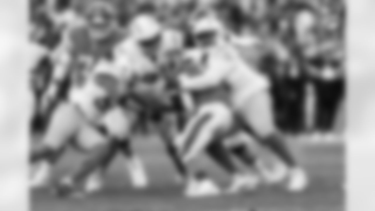 LB Del'Shawn Phillips (53), DT Jamaree Caldwell (99) and DL Otito Ogbonnia (93)