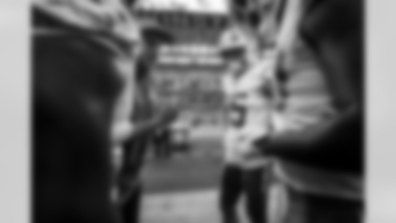 Assistant Special Teams Coach Chris Gould and WR Ladd McConkey (15)