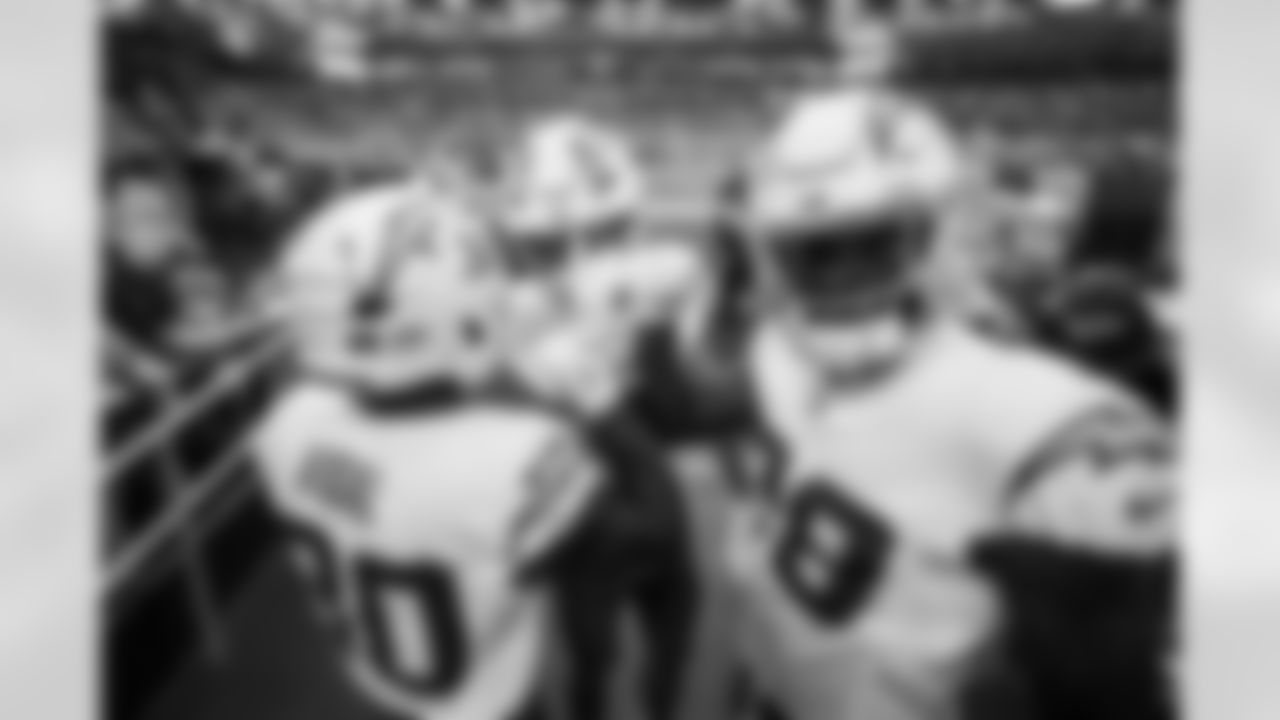 RB Kimani Vidal (30), WR Ladd McConkey (15) and RB Hassan Haskins (28)