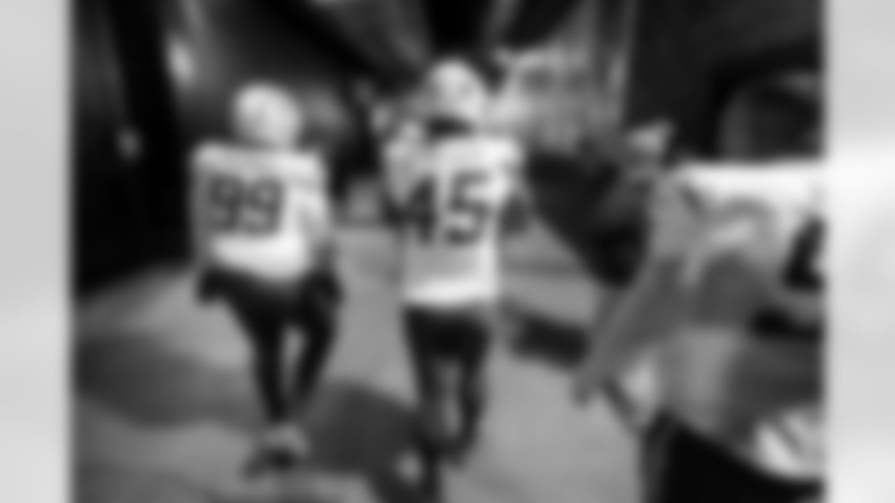 DT Jamaree Caldwell (99) and OLB Tuli Tuipulotu (45)