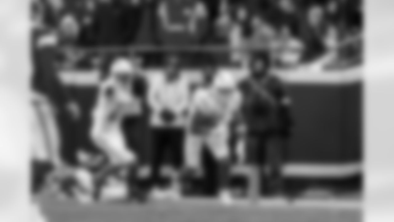 CB Cam Hart (20) and LB Daiyan Henley (0)