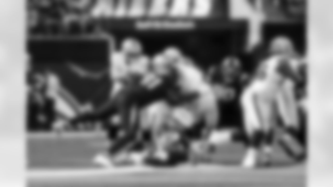 DL Da'Shawn Hand (91), S Tony Jefferson (23) and DL Teair Tart (90)