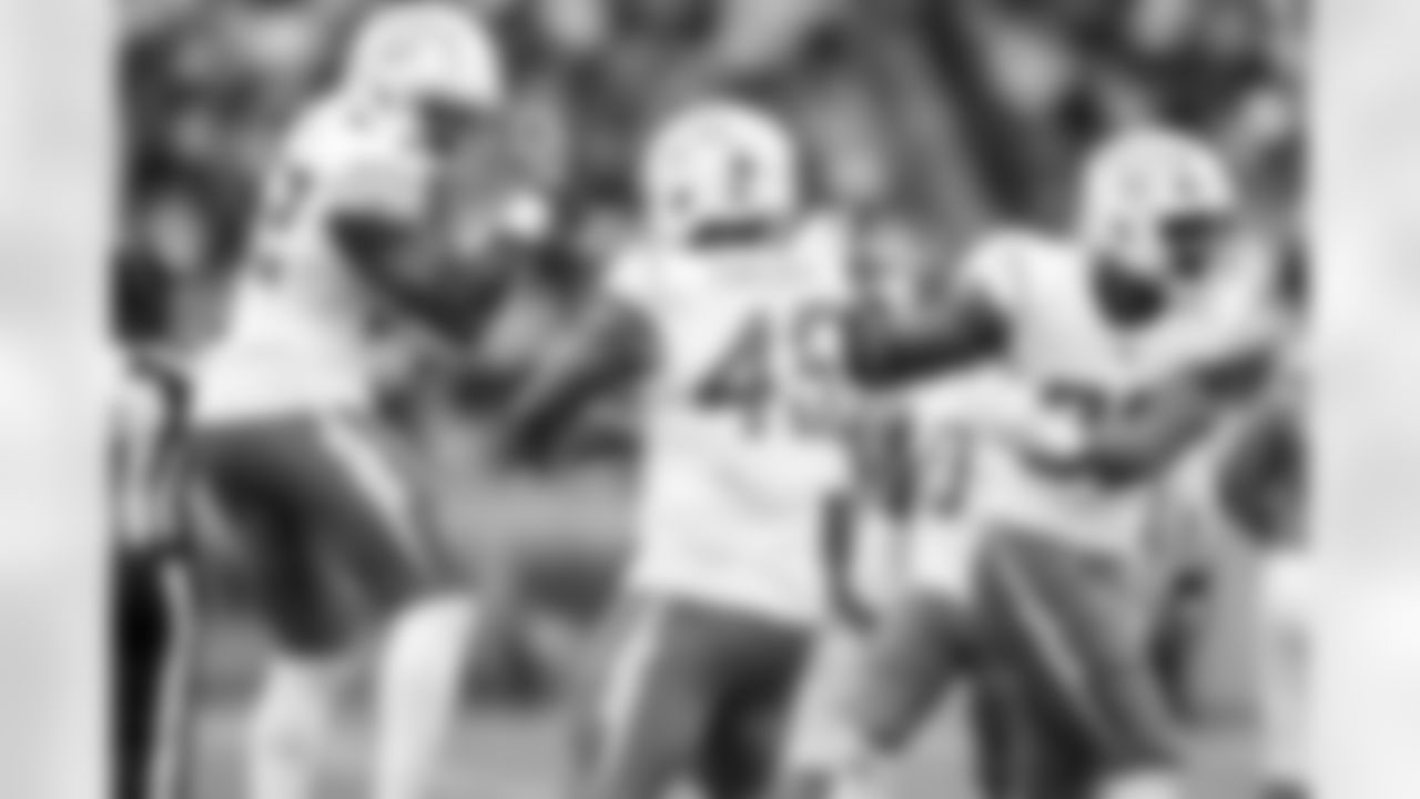 OLB Khalil Mack (52) and OLB Tuli Tuipulotu (45)