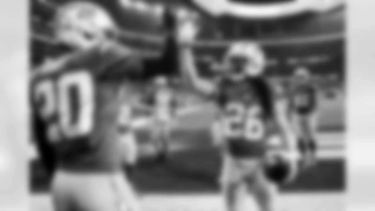 CB Cam Hart (20) and CB Donte Jackson (26)