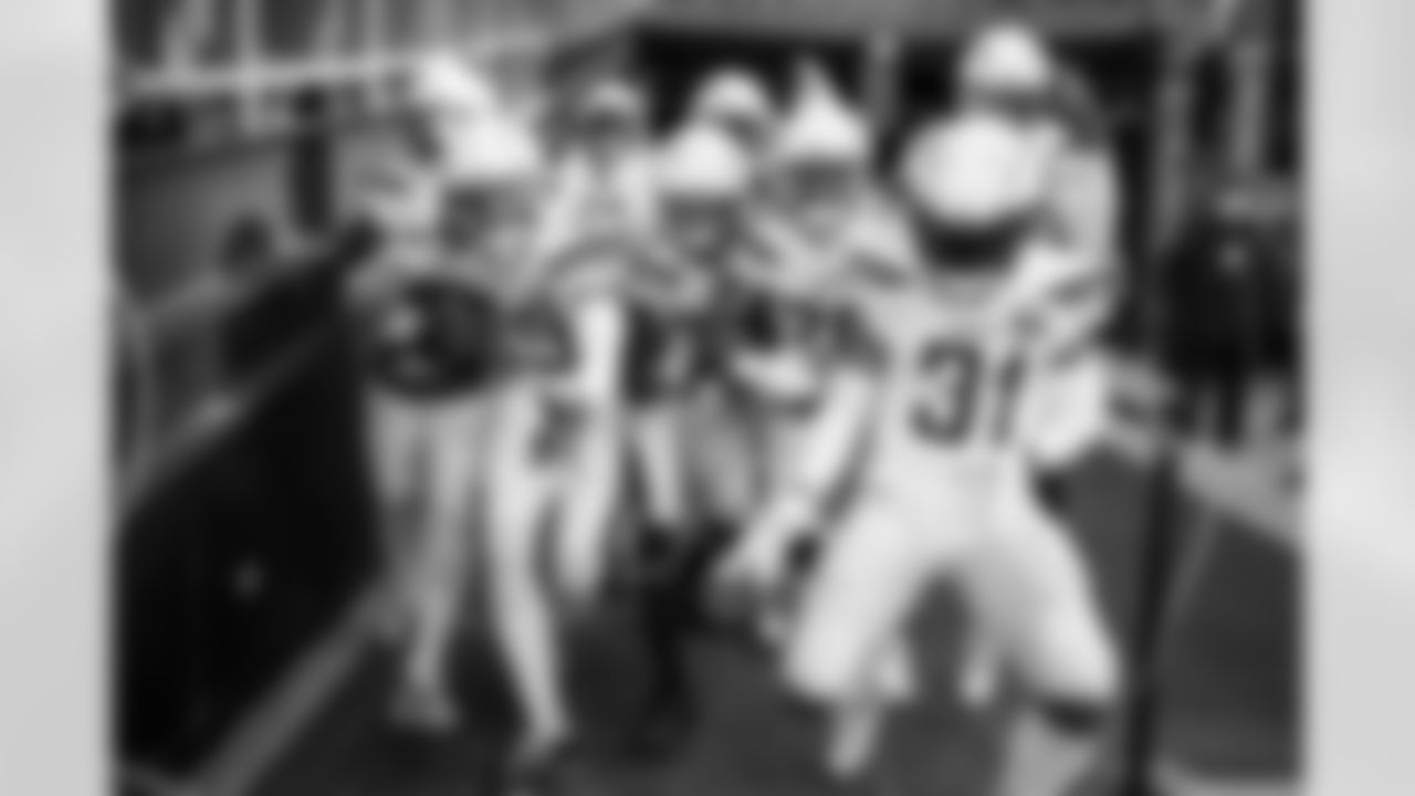 Relive the Chargers' postseason appearances through images from playoff games, highlighting the moments that defined the team in the NFL playoffs.