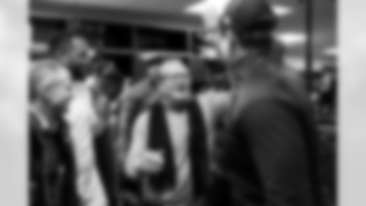 John Spanos, DL Da'Shawn Hand (91), Dean Spanos and Head Coach Jim Harbaugh