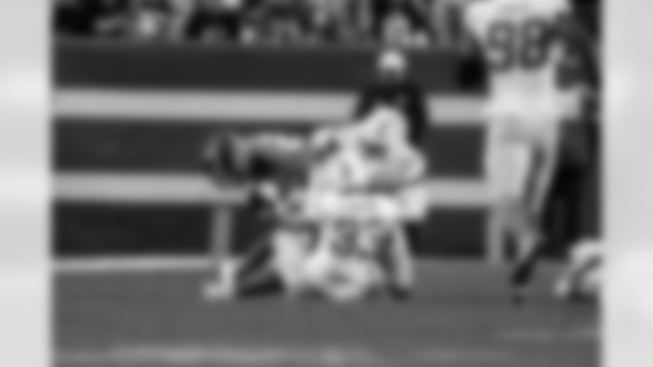 DB Deane Leonard (33) and S Tony Jefferson (23)