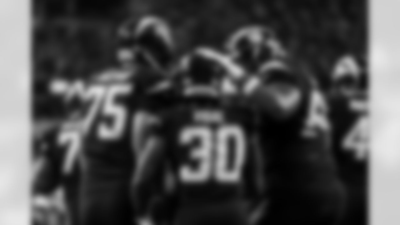 C Bradley Bozeman (75), RB Kimani Vidal (30) and T Bobby Hart (66)