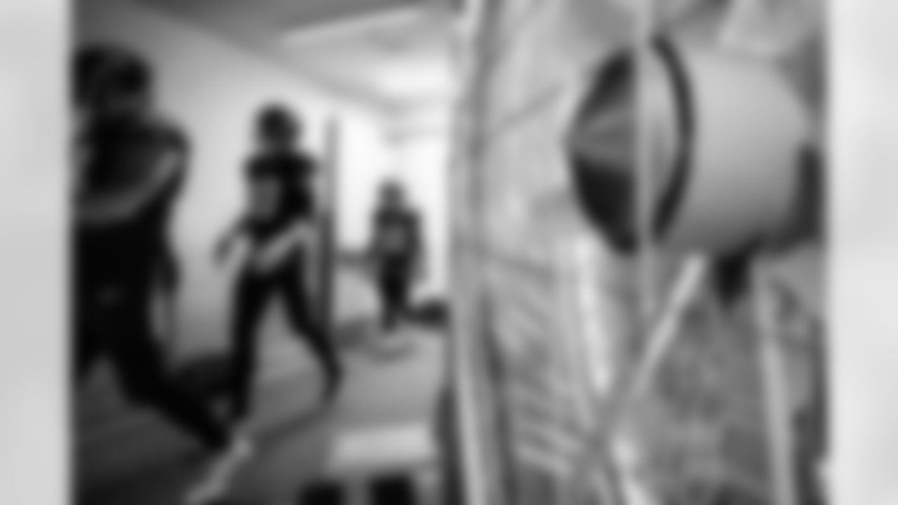 C Andre James (78), QB Justin Herbert (10) and RB Jaret Patterson (32)