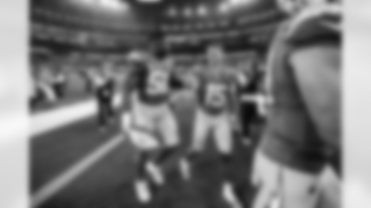 OLB Khalil Mack (52) and WR Ladd McConkey (15)