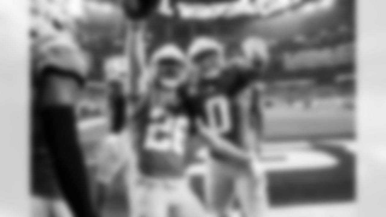 CB Donte Jackson (26) and LB Daiyan Henley (0)