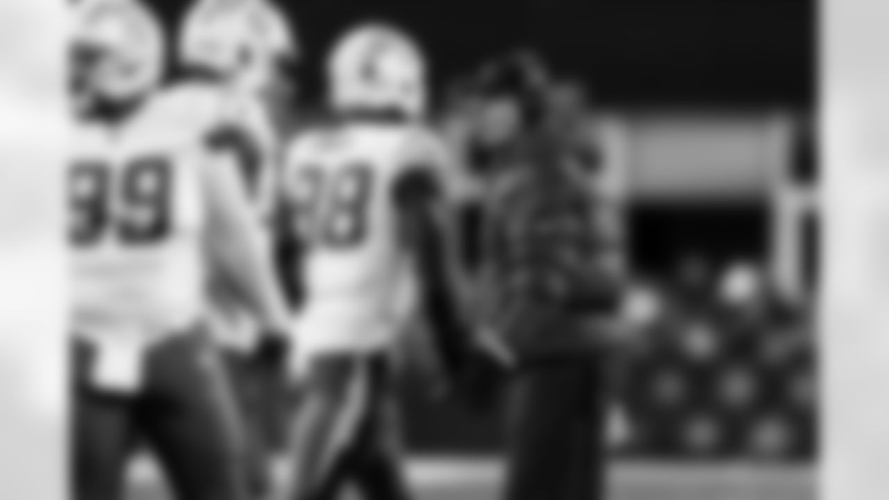 OLB Odafe Oweh (98) and Head Coach Jim Harbaugh