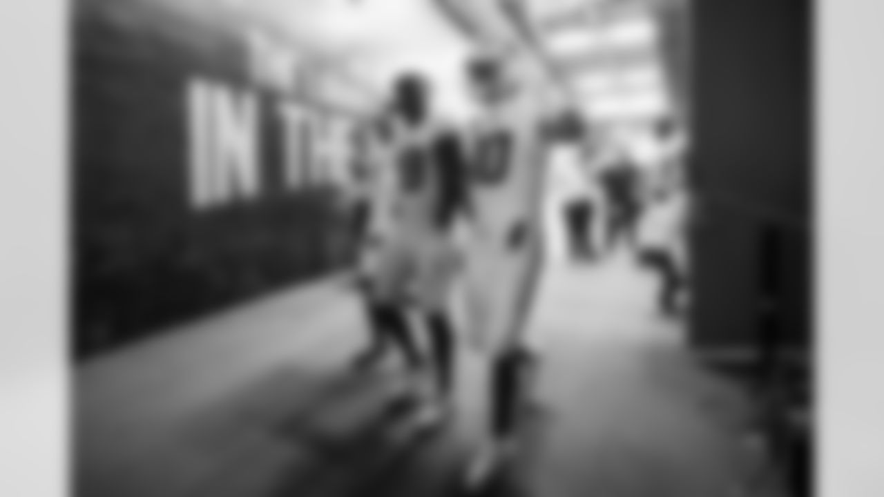 OLB Bud Dupree (48) and QB Justin Herbert (10)