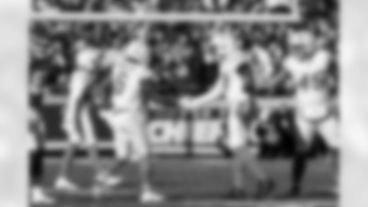 LB Denzel Perryman (6) and OLB Khalil Mack (52)