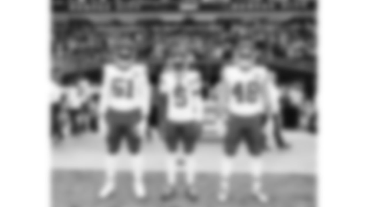 Kansas City Chiefs game captains defensive end Mike Danna (51), wide receiver Hollywood Brown (5) and linebacker Cole Christiansen (48) line up prior to a week 18 NFL football game against the Las Vegas Raiders, Sunday, January 4, 2026 in Las Vegas, NV.