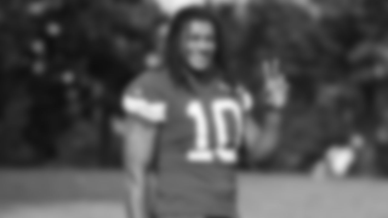 Kansas City Chiefs running back Isiah Pacheco (10) waves to the crowd during training camp on day 1 of practice, Tuesday July 22, 2025