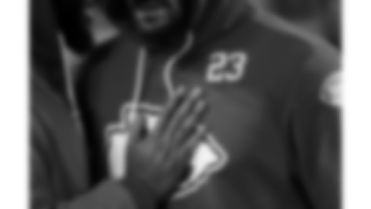 Kansas City Chiefs team chaplain Marcellus Casey prays with middle linebacker Drue Tranquill (23) prior to a week 14 NFL football game against the Houston Texans, Sunday, December 7, 2025 in Kansas City, MO.