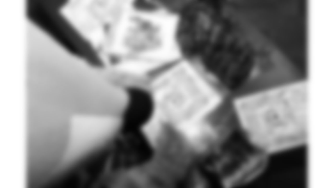 KC Wolf draws with kids before the reveal of cornerback Trent McDuffies (22) My Cause My Cleats at the Solace House in Shawnee Mission, Kansas on Tuesday, November 11, 2025.