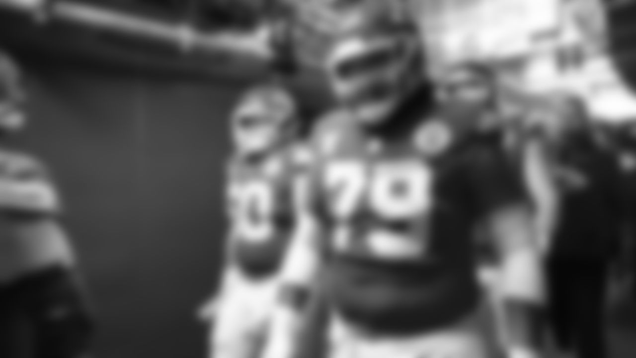 Linebacker Brandon George (50), and Kansas City Chiefs defensive tackle Zach Picken (79) walk down the fifty yard line tunnel wit the rest of the Chiefs prior to an NFL week 17 matchup against the Denver Broncos, Thursday, December 25, 2025.