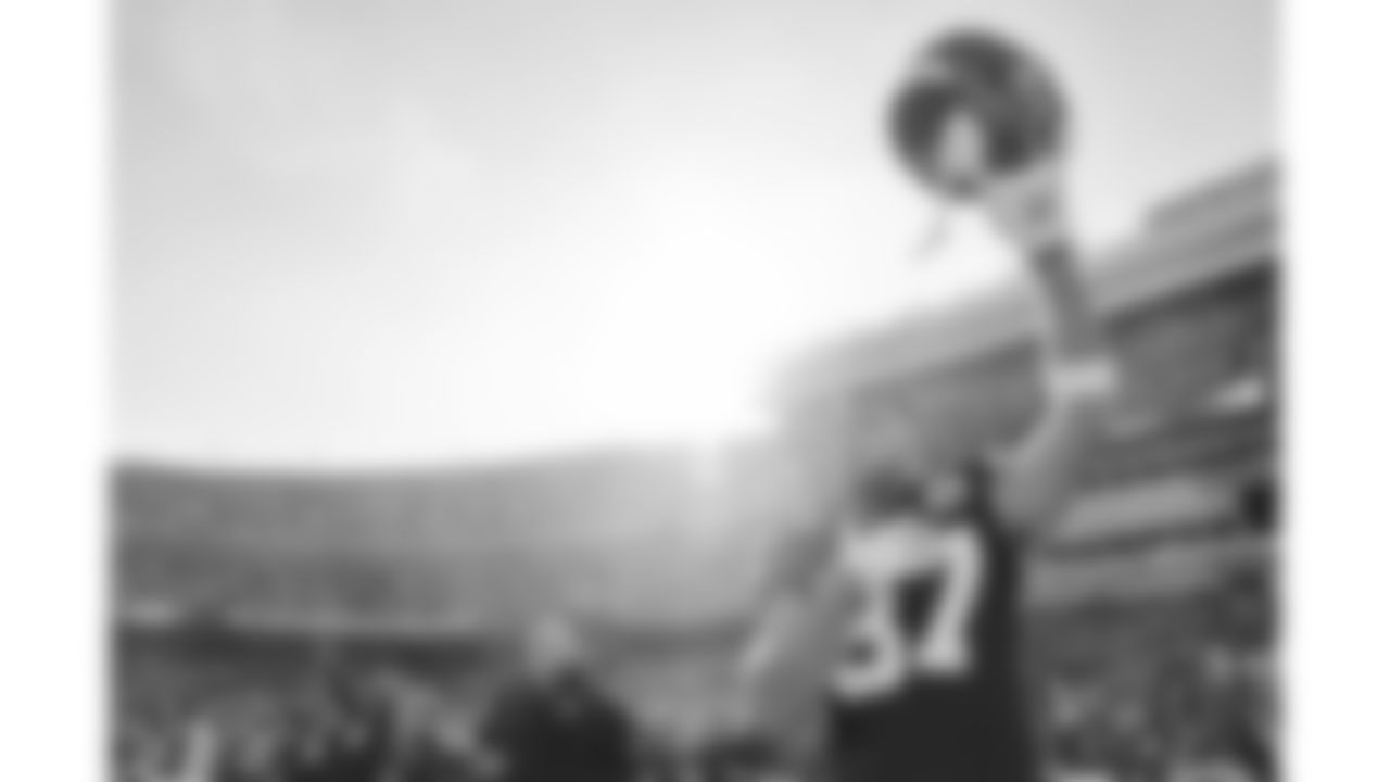 Kansas City Chiefs tight end Travis Kelce (87) raises his helmet during the National Anthem prior to a week 12 NFL football game against the Indianapolis Colts, Sunday, November 23, 2025 in Kansas City, MO.