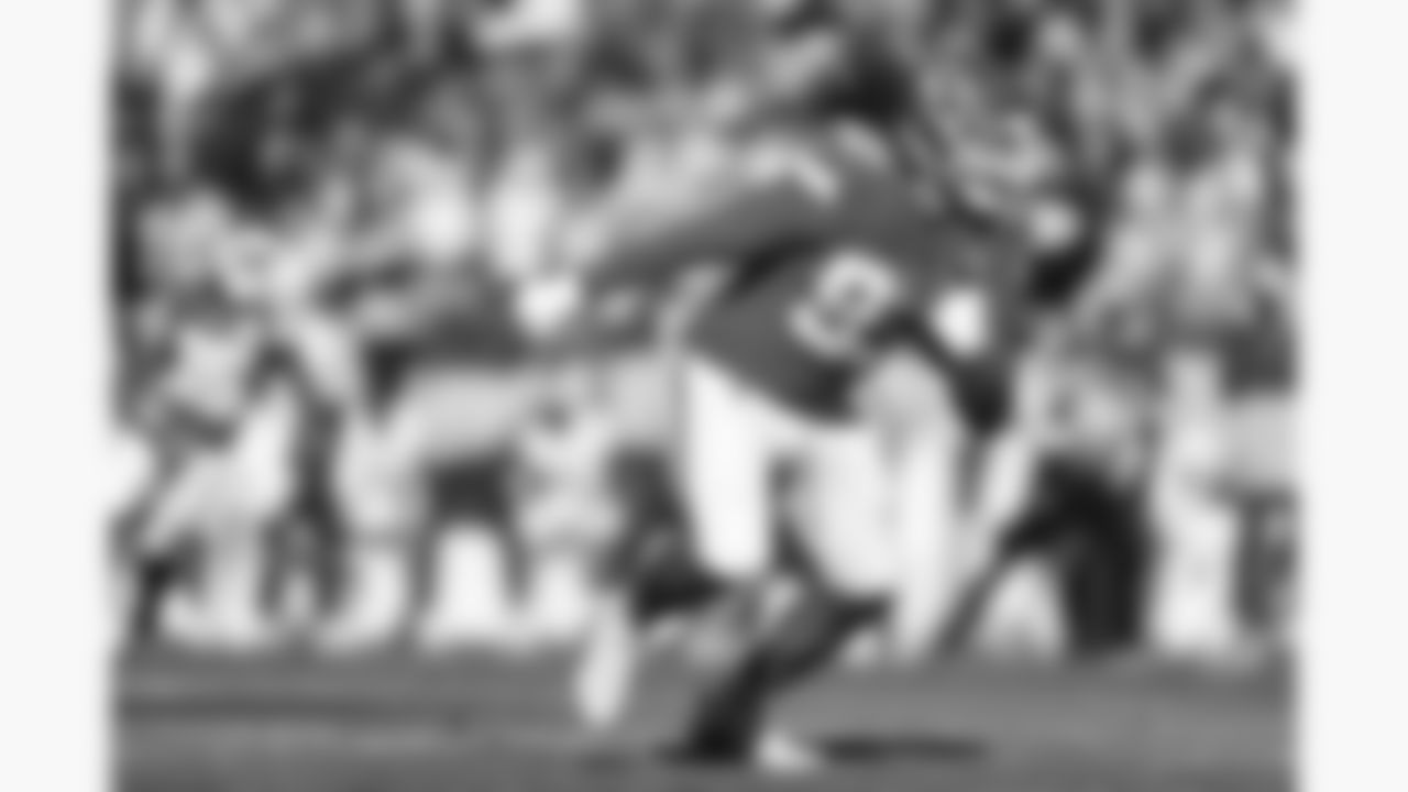 Kansas City Chiefs defensive end Ashton Gillotte (97) intercepts the ball during a week 15 NFL football game against the Los Angeles Chargers, Sunday, December 14, 2025 in Kansas City, MO.