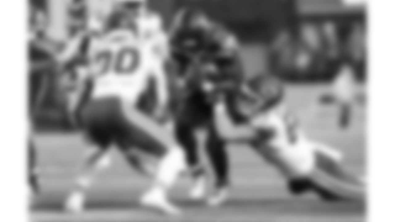 Kansas City Chiefs linebacker Cooper McDonald (59) tackles Seattle Seahawks running back Anthony Tyus III (35) during a preseason week 2 NFL football game, Friday, August 15, 2025 in Seattle, WA.