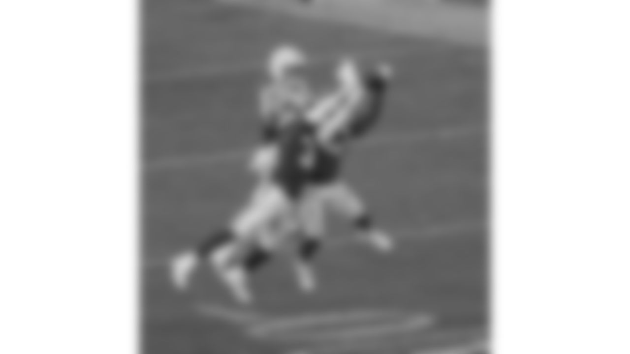 Kansas City Chiefs linebacker Nick Bolton (32) and defensive back Chamarri Conner (27) break up a pass during a week 12 NFL football game against the Indianapolis Colts, Sunday, November 23, 2025 in Kansas City, MO.