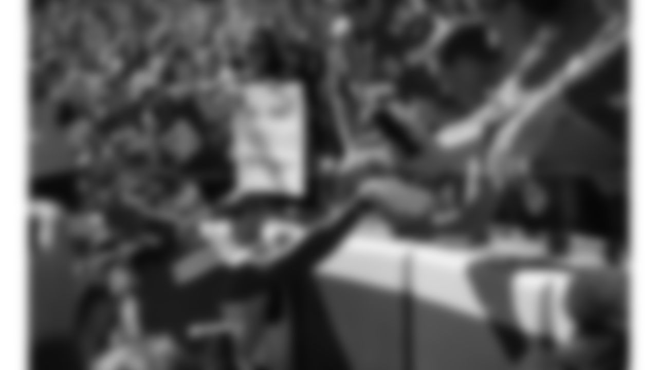 Kansas City Chiefs wide receiver Rashee Rice (4) hands his touchdown ball to a young fan during a week 7 NFL football game against the Las Vegas Raiders, Sunday, October 19, 2025 in Kansas City, MO.