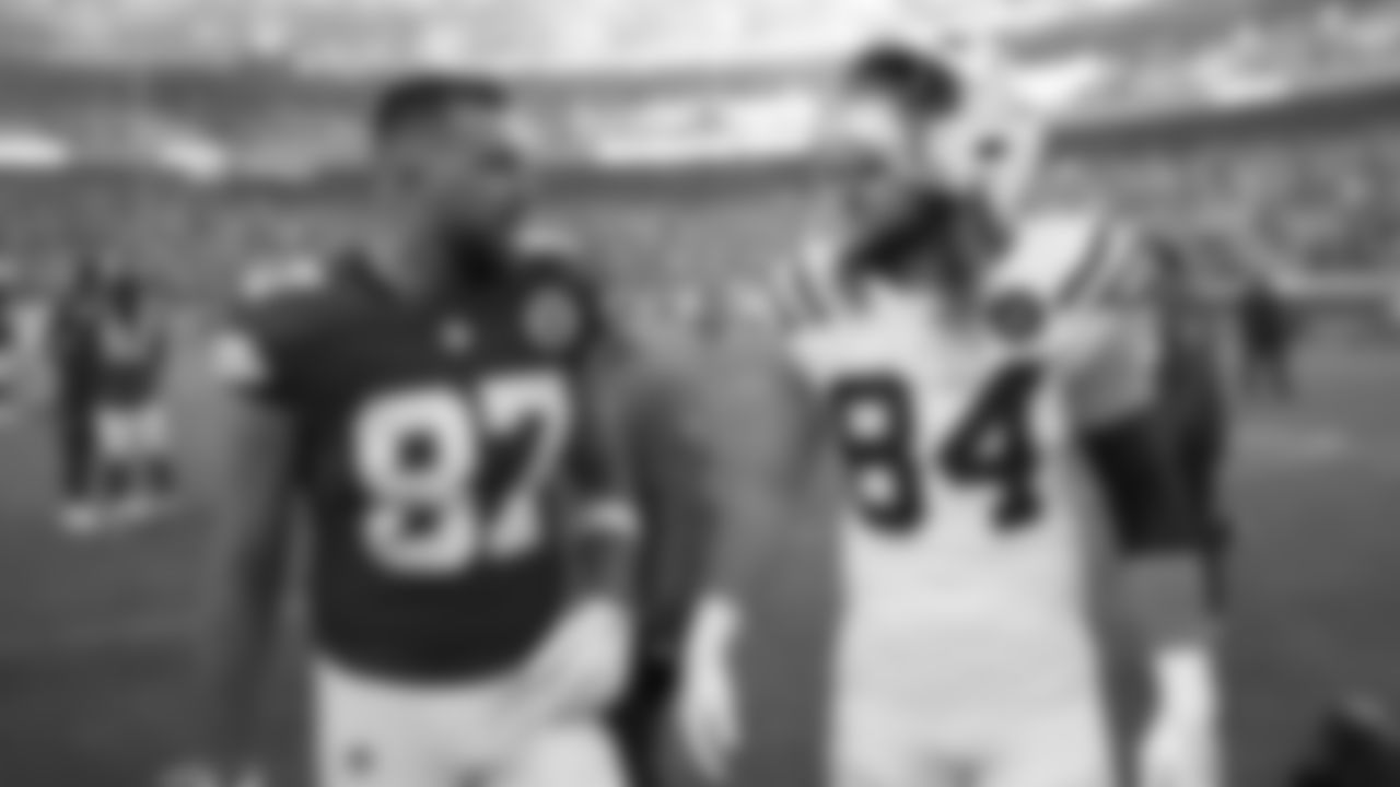 Kansas City Chiefs tight end Travis Kelce (87) talks with Indianapolis Colts tight end Tyler Warren (84) after a week 12 NFL Football game against the Indianapolis Colts on Sunday, November 23, 2025 in Kansas City, MO