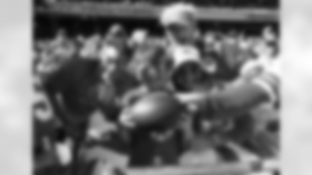 A young Kansas City Chiefs fan holds a game ball during a week 7 NFL football game against the Las Vegas Raiders, Sunday, October 19, 2025 in Kansas City, MO.