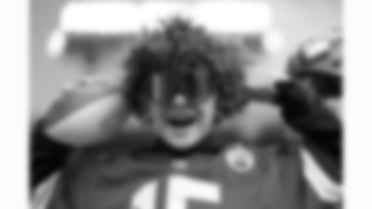 A young Kansas City Chiefs fan flexes prior to a week 16 NFL football game against the Tennessee Titans, Sunday, December 21, 2025 in Nashville, TN.