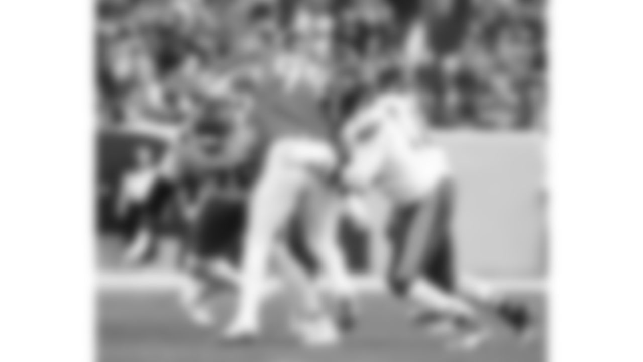 Kansas City Chiefs tackles Kingsley Suamataia (76) and Josh Simmons (71) block a Broncos defender during a week 11 NFL Football game against the Denver Broncos on Sunday, November 16, 2025 in Denver, Colorado.