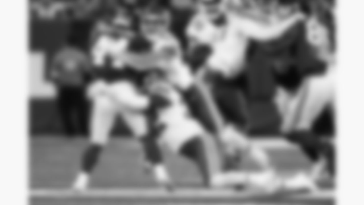 Kansas City Chiefs linebacker Leo Chenal (54) and linebacker Nick Bolton (32) hit New York Giants running back Cam Skattebo (44) during the week 3 NFL football game, Sunday, September 21, 2025 in East Rutherford, NJ.