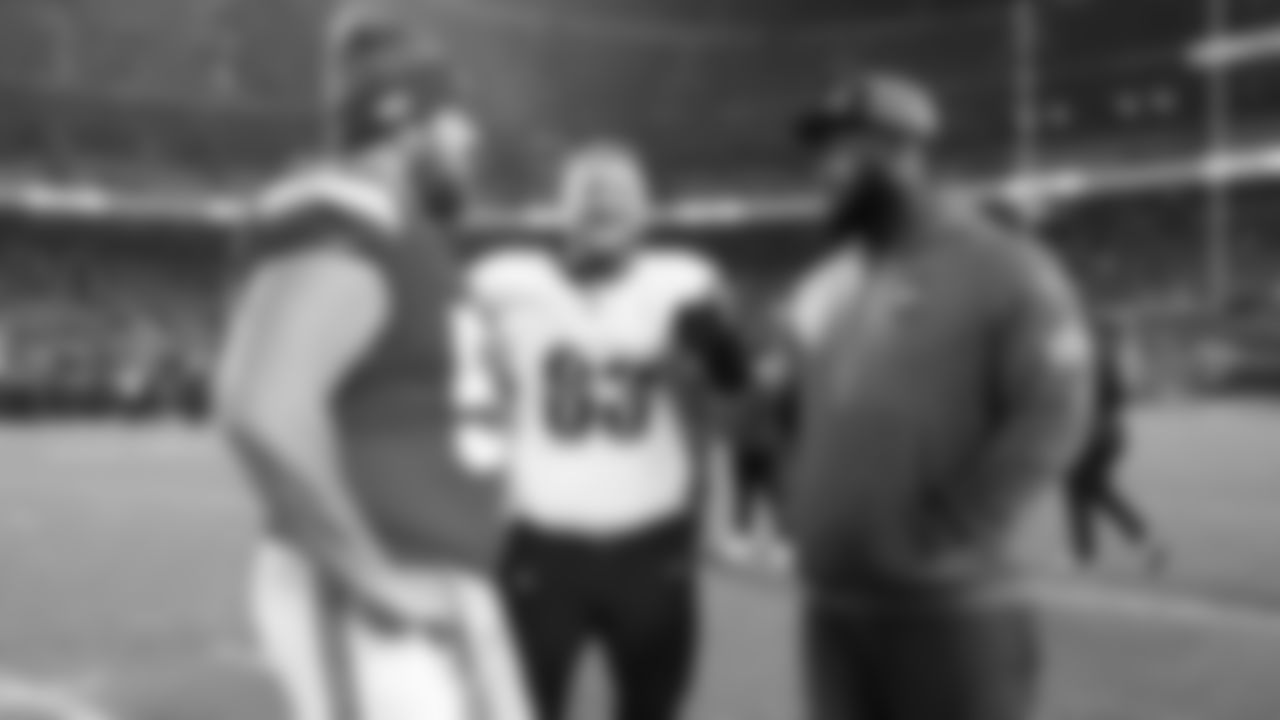 Center Creed Humphrey (52) and Kansas City Chiefs offensive lineman Trey Smith (65) talk with Washington Commanders center Tyler Biadasz (63) after a week 8 NFL Football game against the Washington Commanders on Monday, October 27, 2025 in Kansas City, MO.
