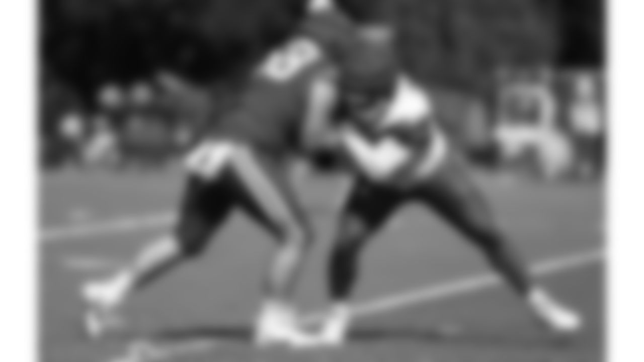 Kansas City Chiefs offensive lineman Joey Lombard (68) and defensive tackle Fabien Lovett (96) participate in drills during day 5 of training camp practice on Sunday, July 27, 2025.