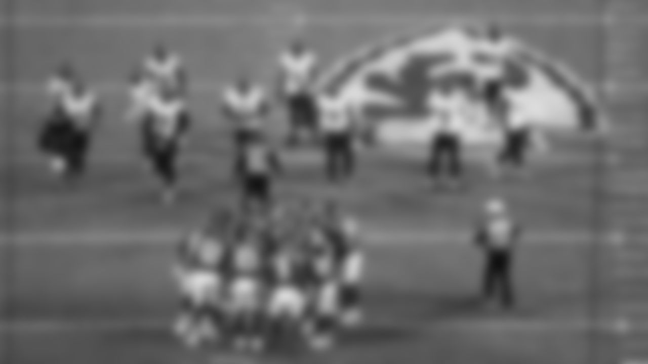 Kansas City Chiefs offensive line in a huddle during a week 8 NFL Football game against the Washington Commanders on Monday, October 27, 2025 in Kansas City, MO.