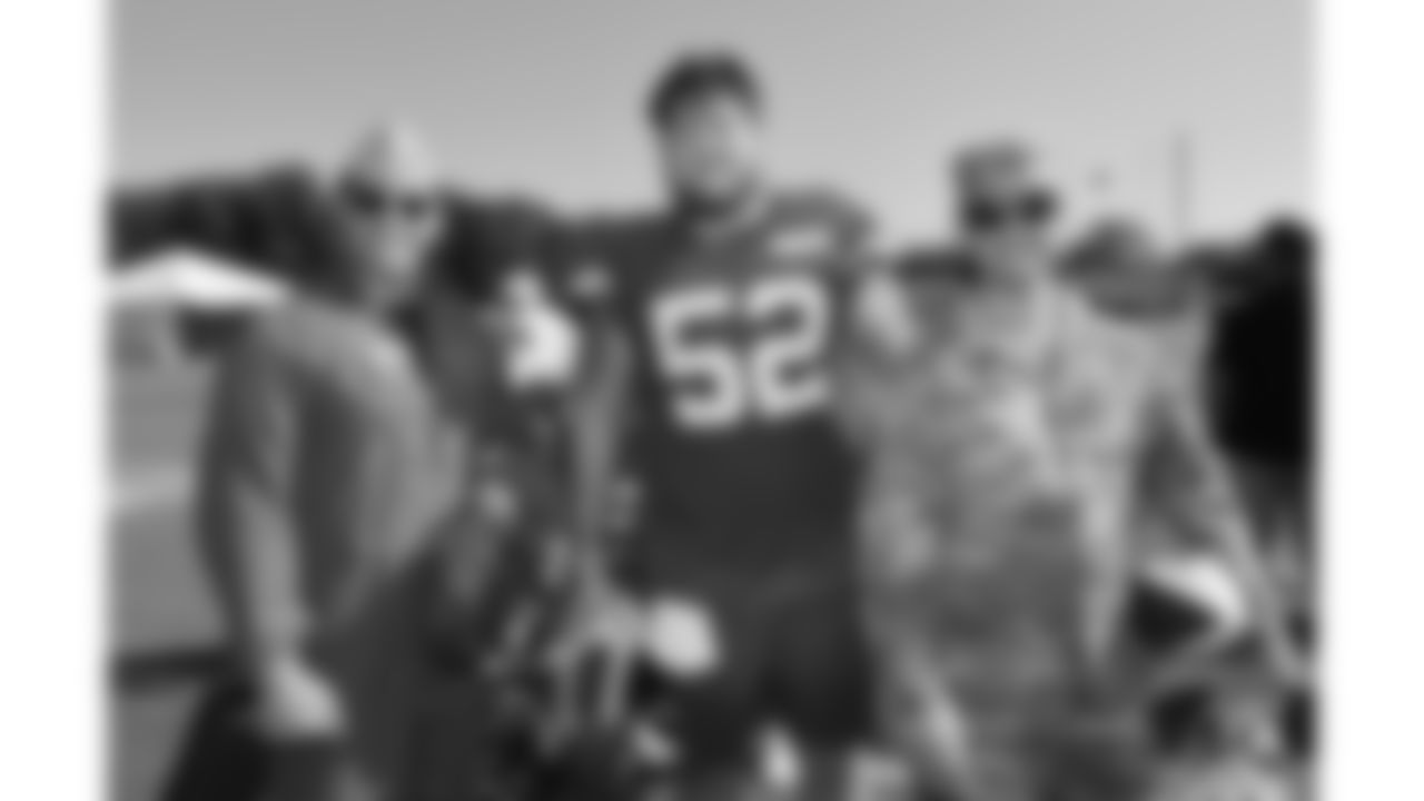 U.S. service members poses with Kansas City Chiefs center Creed Humphrey (52) while attending Military Appreciation Day during day 17 of Training Camp practice on Wednesday, August 13, 2025.