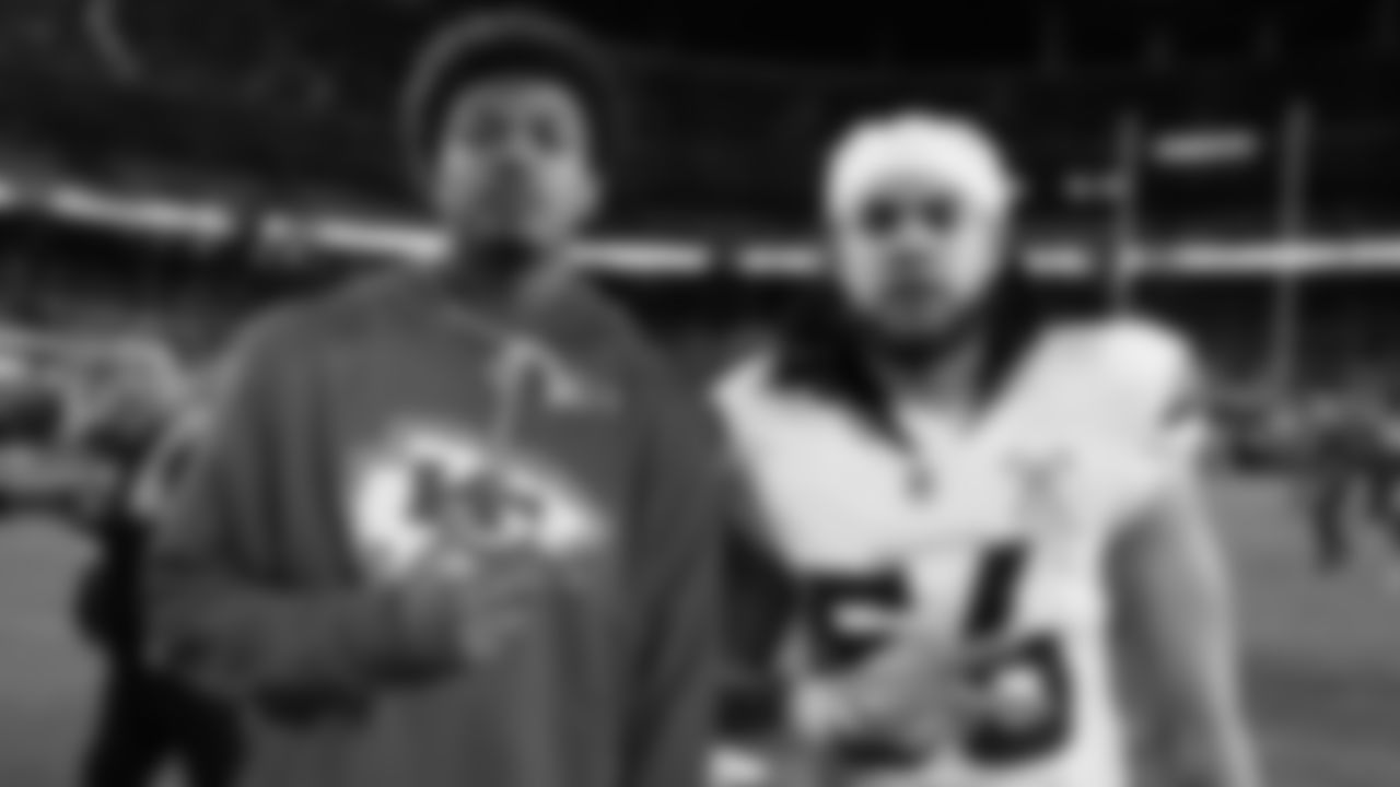 Kansas City Chiefs tight end Tre Watson (49) poses with Denver Broncos linebacker Levelle Bailey (56) after an NFL week 17 matchup against the Denver Broncos, Thursday, December 25, 2025.