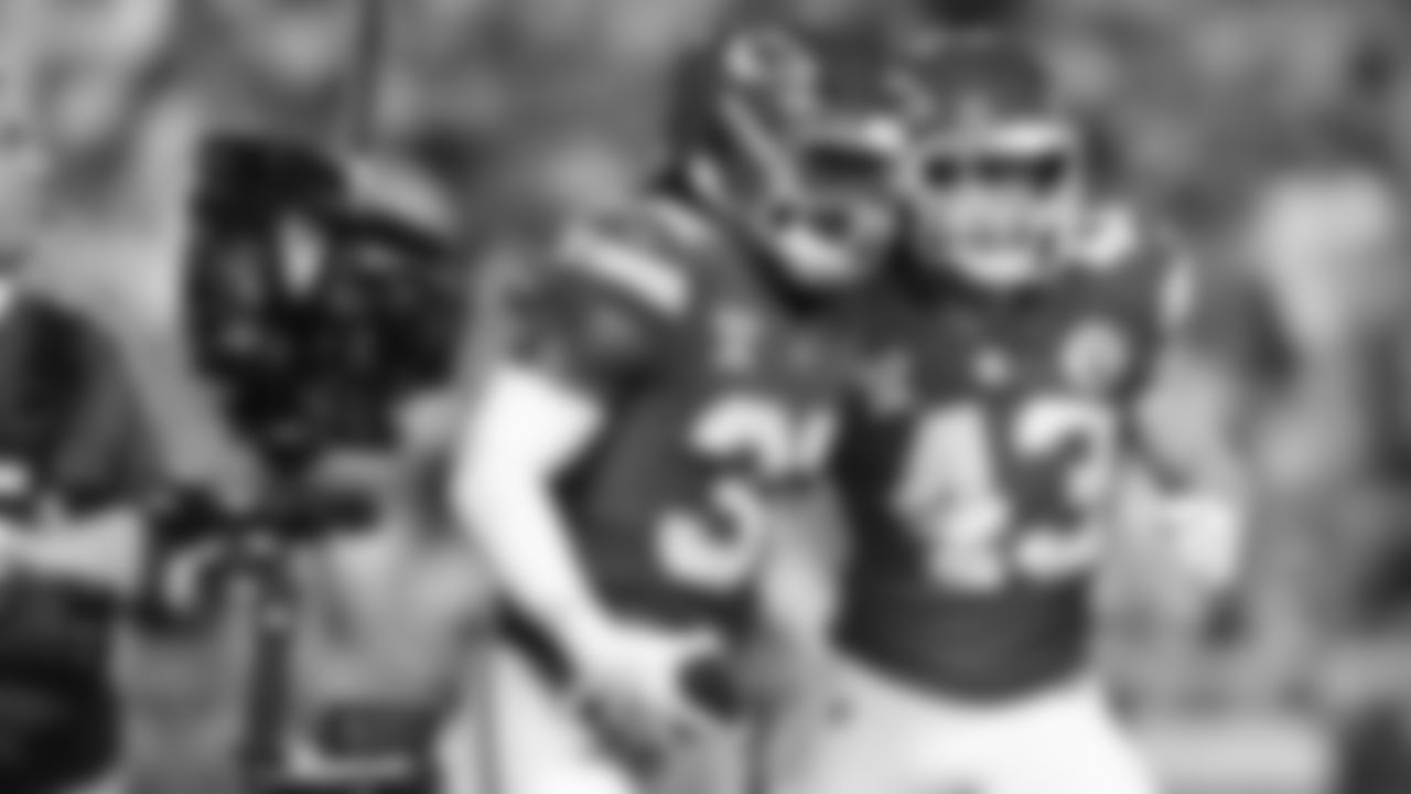 Linebacker Nick Bolton (32) celebrates with Kansas City Chiefs linebacker Jack Cochrane (43) after his interception during an NFL week 17 matchup against the Denver Broncos, Thursday, December 25, 2025.