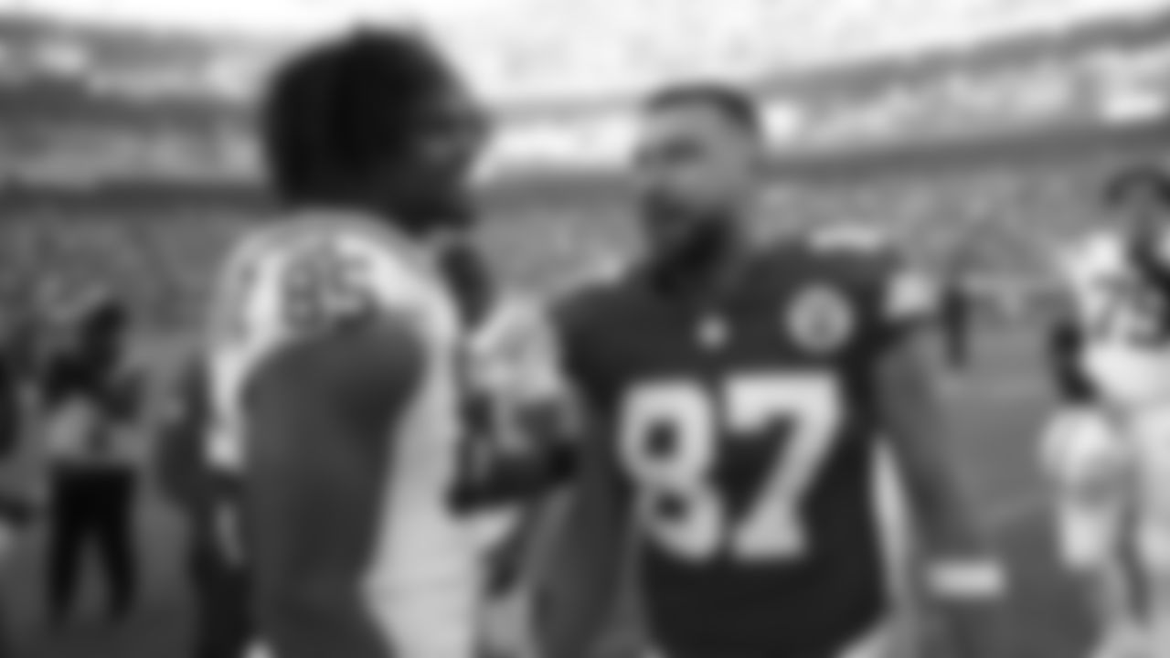 Kansas City Chiefs tight end Travis Kelce (87) talks with Indianapolis Colts tight end Drew Ogletree (85) after a week 12 NFL Football game against the Indianapolis Colts on Sunday, November 23, 2025 in Kansas City, MO