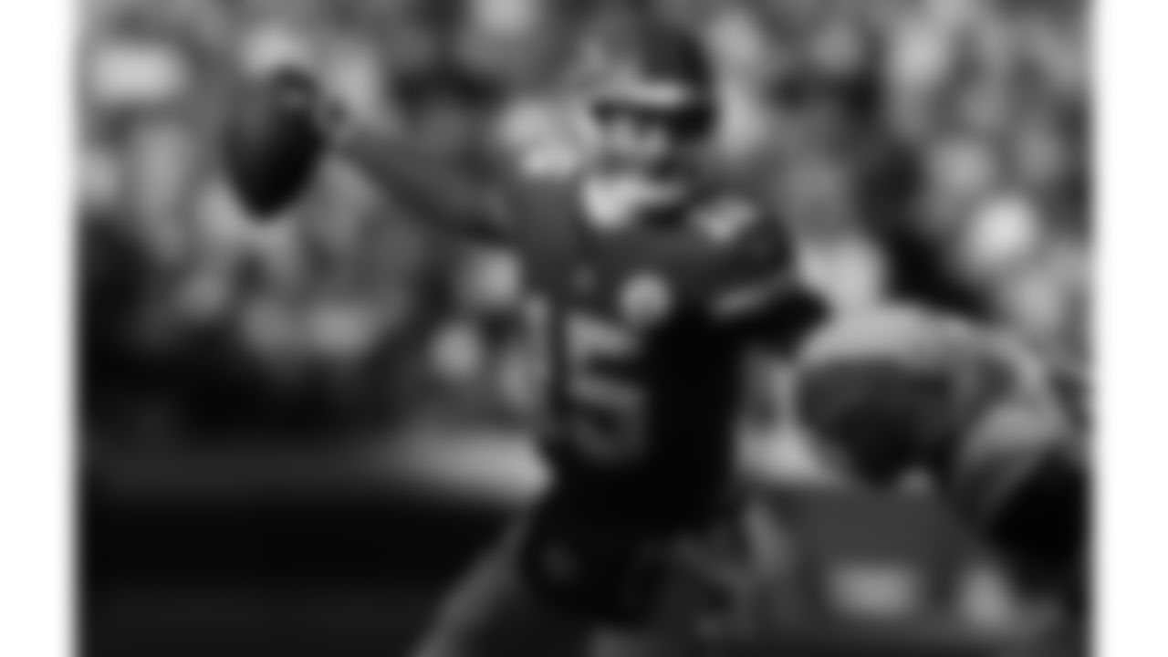 Kansas City Chiefs quarterback Patrick Mahomes (15) scrambles under pressure from Los Angeles Chargers safety Tony Jefferson (23) during a week 15 NFL football game, Sunday, December 14, 2025 in Kansas City, MO.