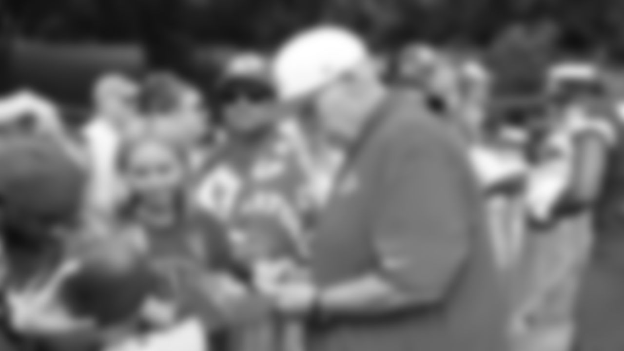 Kansas City Chiefs Head Coach Andy Reid signs autographs after training camp on day 1 of practice, Tuesday July 22, 2025