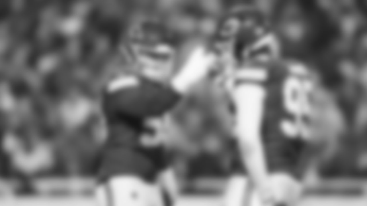 Defensive end George Karlaftis (56) celebrates with Kansas City Chiefs defensive tackle Chris Jones (95) during an NFL week 14 matchup against the Houston Texans, Sunday December 7, 2025.