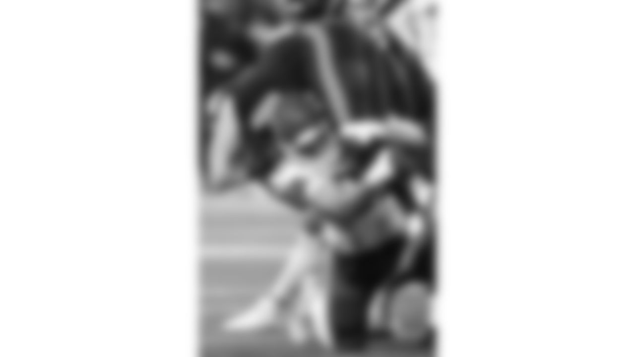 Kansas City Chiefs defensive end Ashton Gillotte (97) tackles Seattle Seahawks wide receiver Jake Bobo (19) during a preseason week 2 NFL football game, Friday, August 15, 2025 in Seattle, WA.